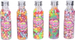 Gekleurde kralen in een flesje