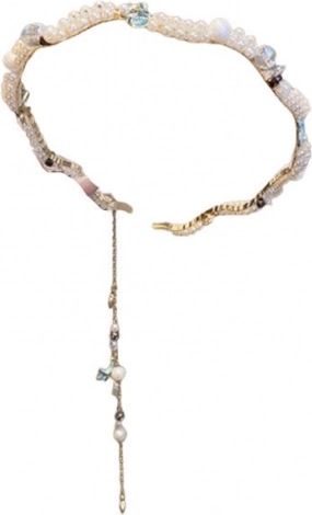 Decoratieve haarband met schelpmotief en pareltjes