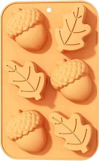 Oranje siliconen bakvorm dennenappel en blad 27 × 17 × 3 cm