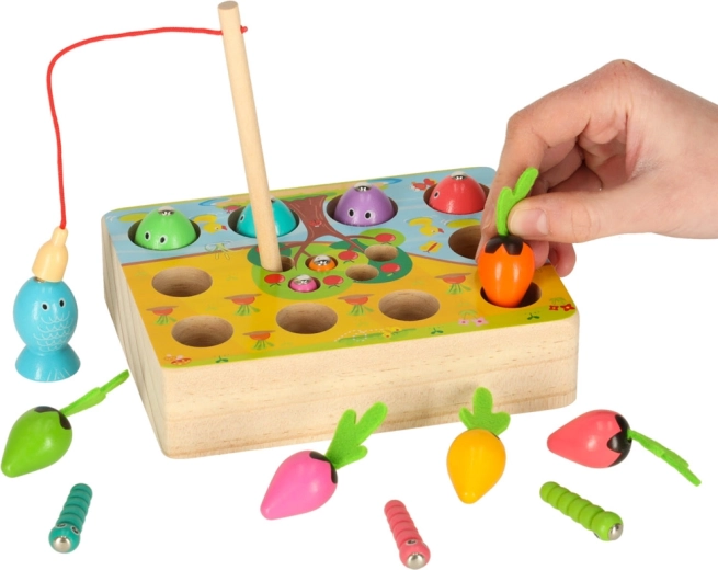 Sensorisch spel met het oogsten van worteltjes