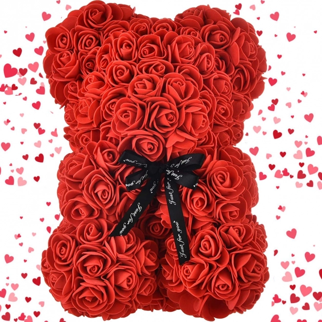 Teddybeer van roze bloemblaadjes in geschenkdoos