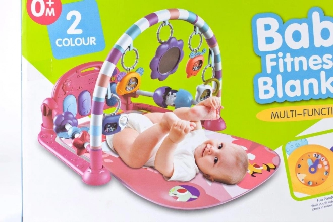Roze educatieve speelkleed met piano en rammelaars