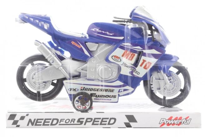 Blauwe plastic motorfiets op traagheidswiel