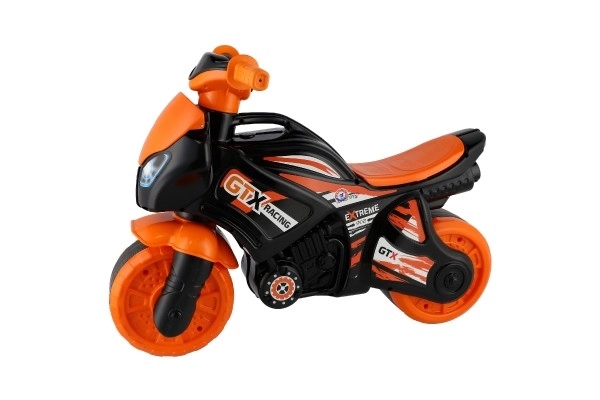 Loopmotor oranje-zwart plastic in zak 35x53x74cm 24m+