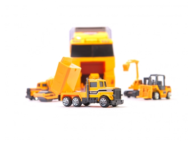 Vrachtwagen met bouwvoertuigen