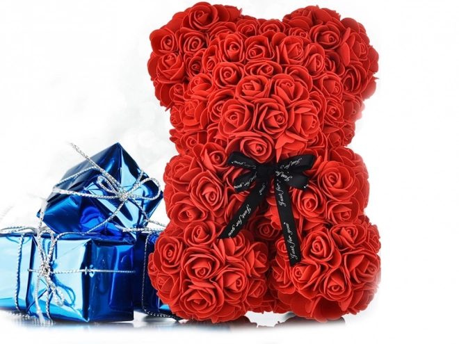 Teddybeer van roze bloemblaadjes in geschenkdoos