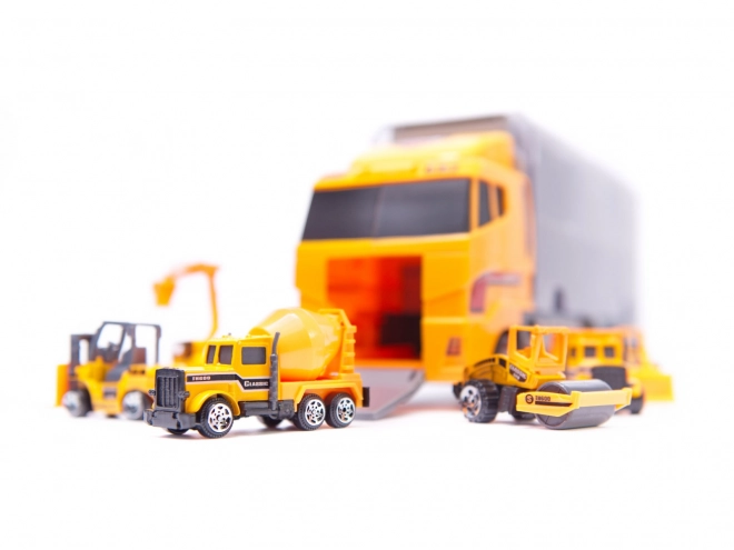 Vrachtwagen met bouwvoertuigen
