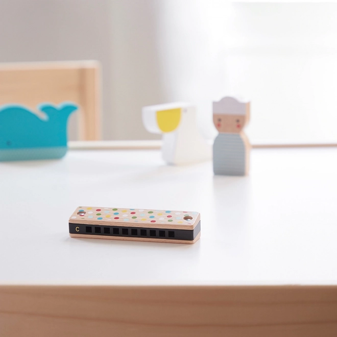 Houten harmonica met strepen en stippen
