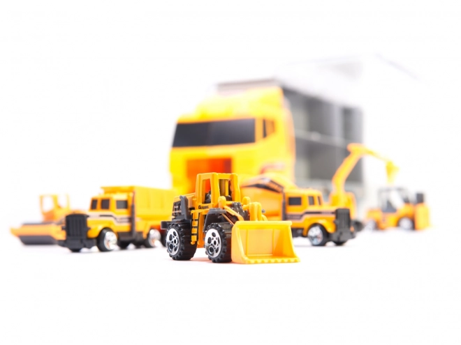 Vrachtwagen met bouwvoertuigen