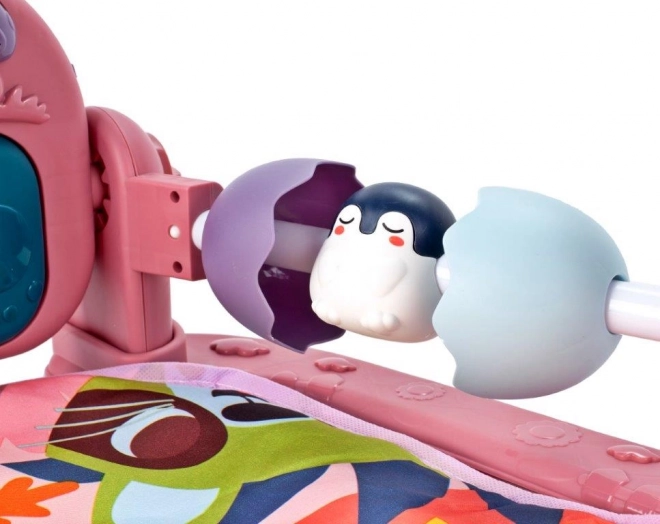 Roze educatieve speelkleed met piano en rammelaars