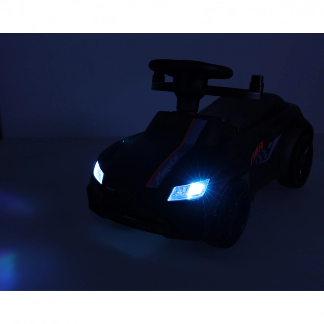 zwart kinderauto met muziek en lichtjes