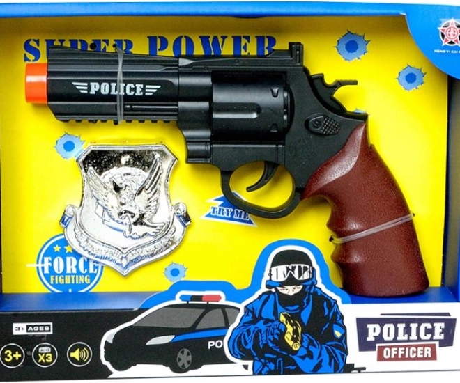 Politiepistool met badge PLEJO